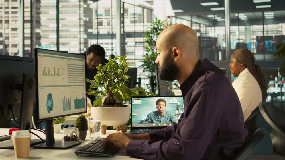 Remote engineering team collaboration showing distributed developers working on shared projects with communication tools and project management dashboards